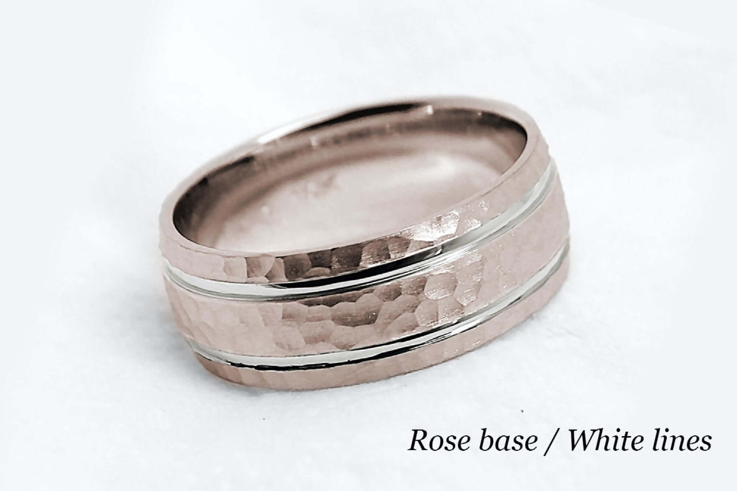 8mm wide Solid rose gold ring for men featuring hammered finish and white gold polished lines. Low dome look with comfort fit.