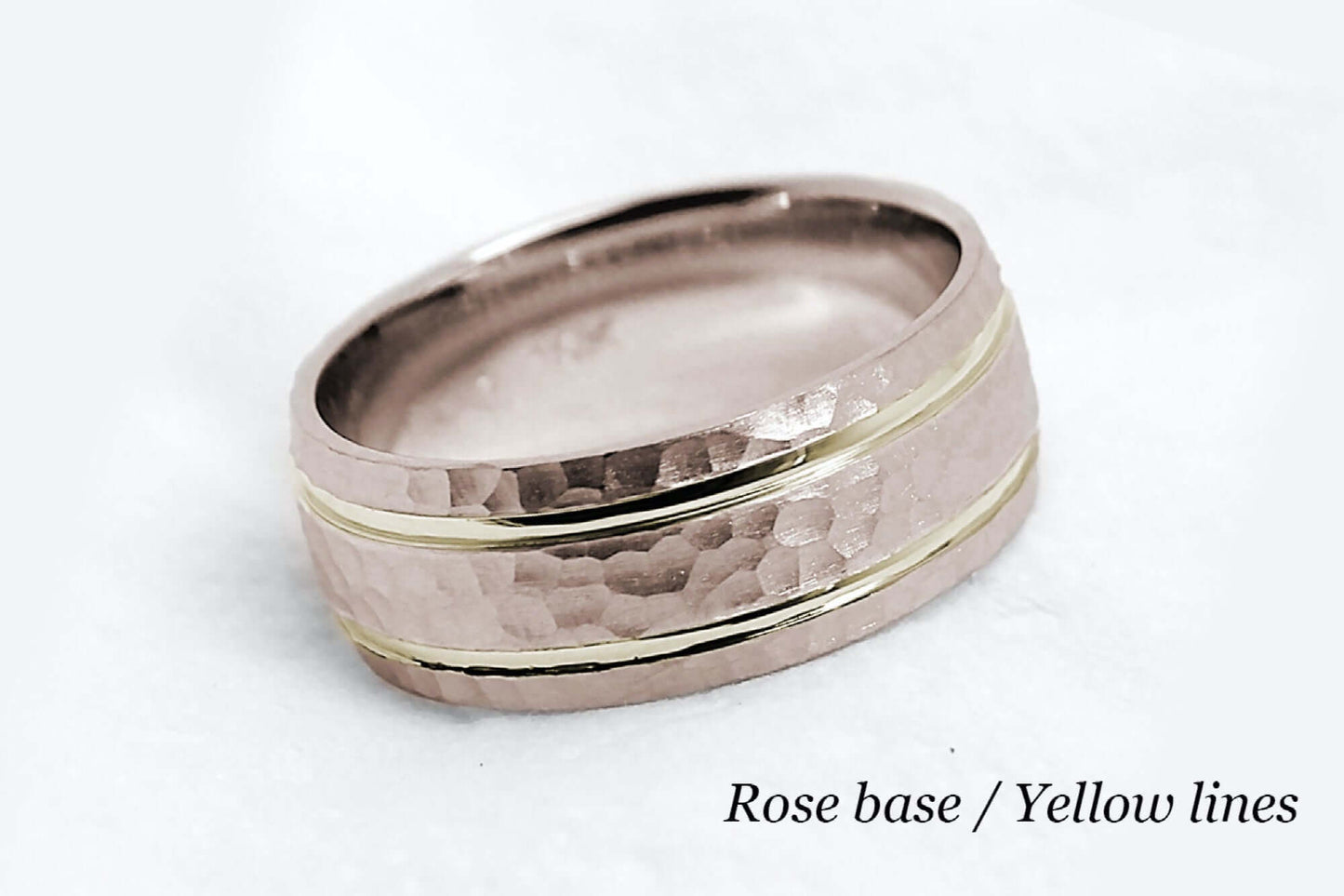 8mm wide Solid rose gold ring for men featuring hammered finish and yellow gold polished lines. Low dome look with comfort fit.