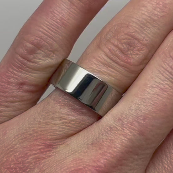 Flat Polished Titanium Ring in 8mm width on the finger