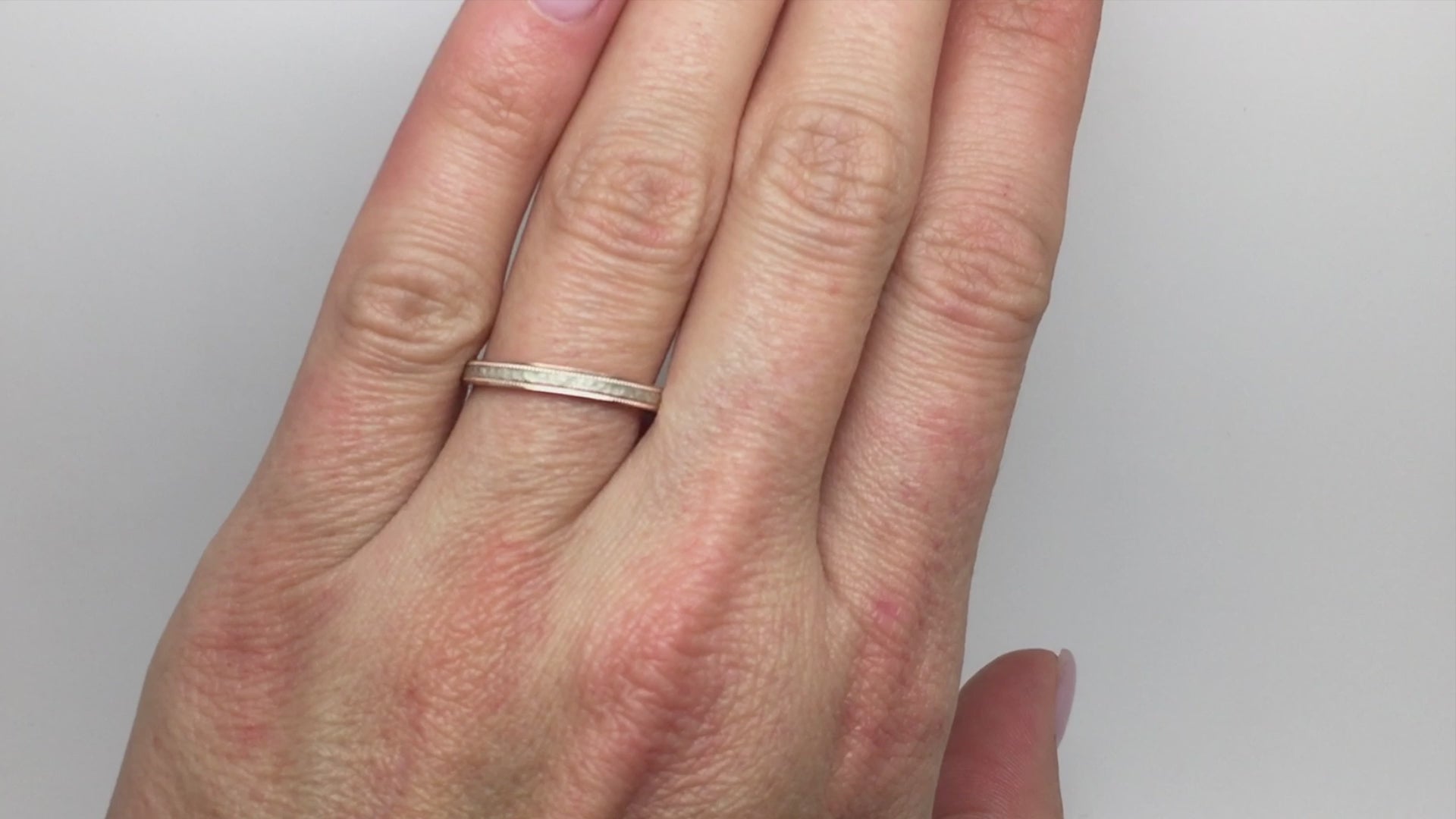 rose gold base white gold centre hammered ring.