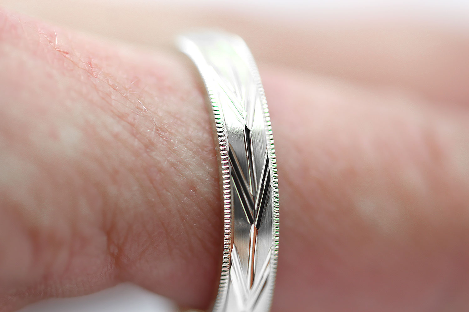 4mm solid 925 sterling silver wedding band, featuring brushed centre with incut arrows design and milgrain edge, the wedding band is with rhodium plating