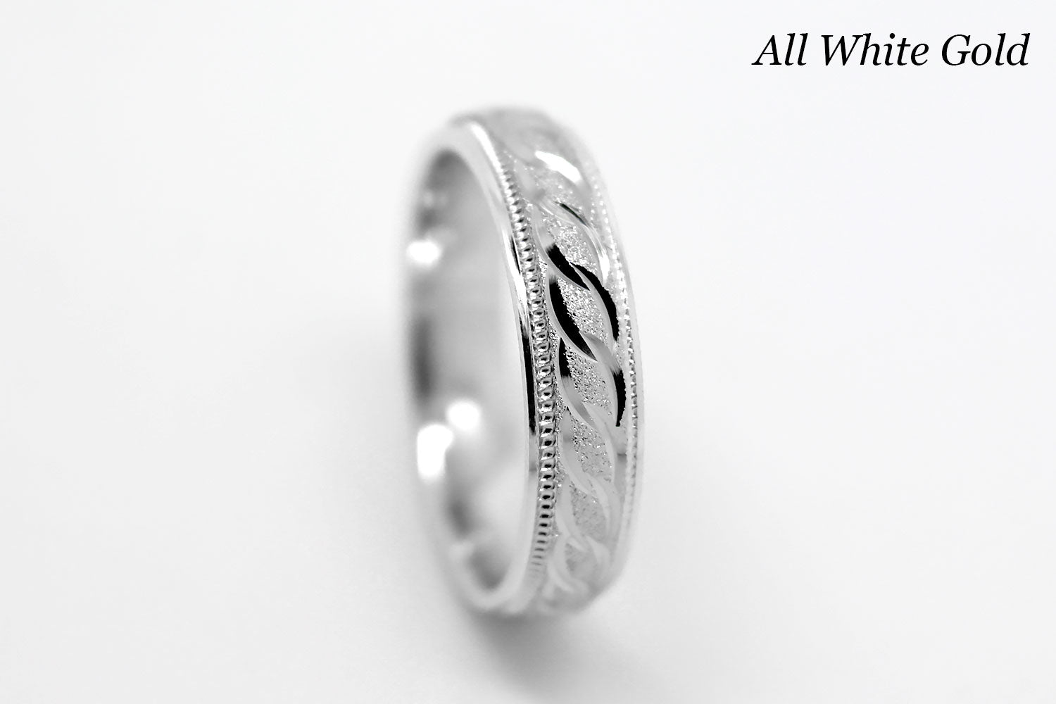 4mm solid gold wedding band in white gold, featuring stone finish centre with incut moons design and milgrain edge, available in 10k gold 14k gold and 18k gold