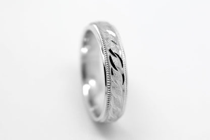 4mm solid 925 sterling silver wedding band in white gold, featuring stone finish centre with incut moons design and milgrain edge