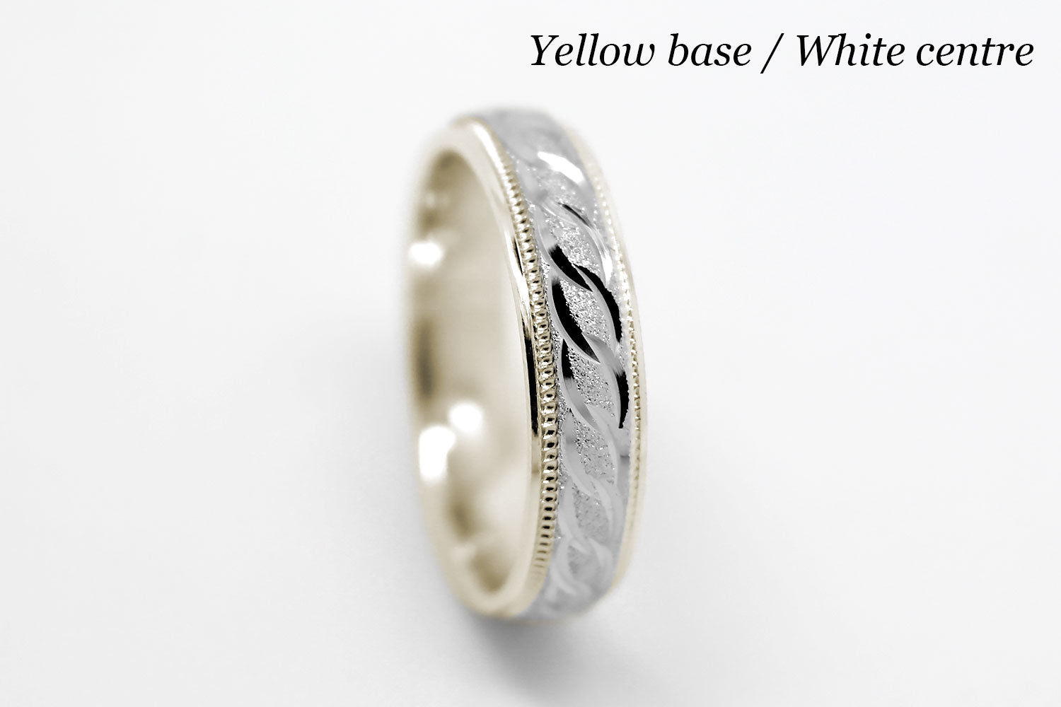 4mm solid gold wedding band with yellow gold base and white gold, featuring stone finish centre with incut moons design and milgrain edge, available in 10k gold 14k gold and 18k gold