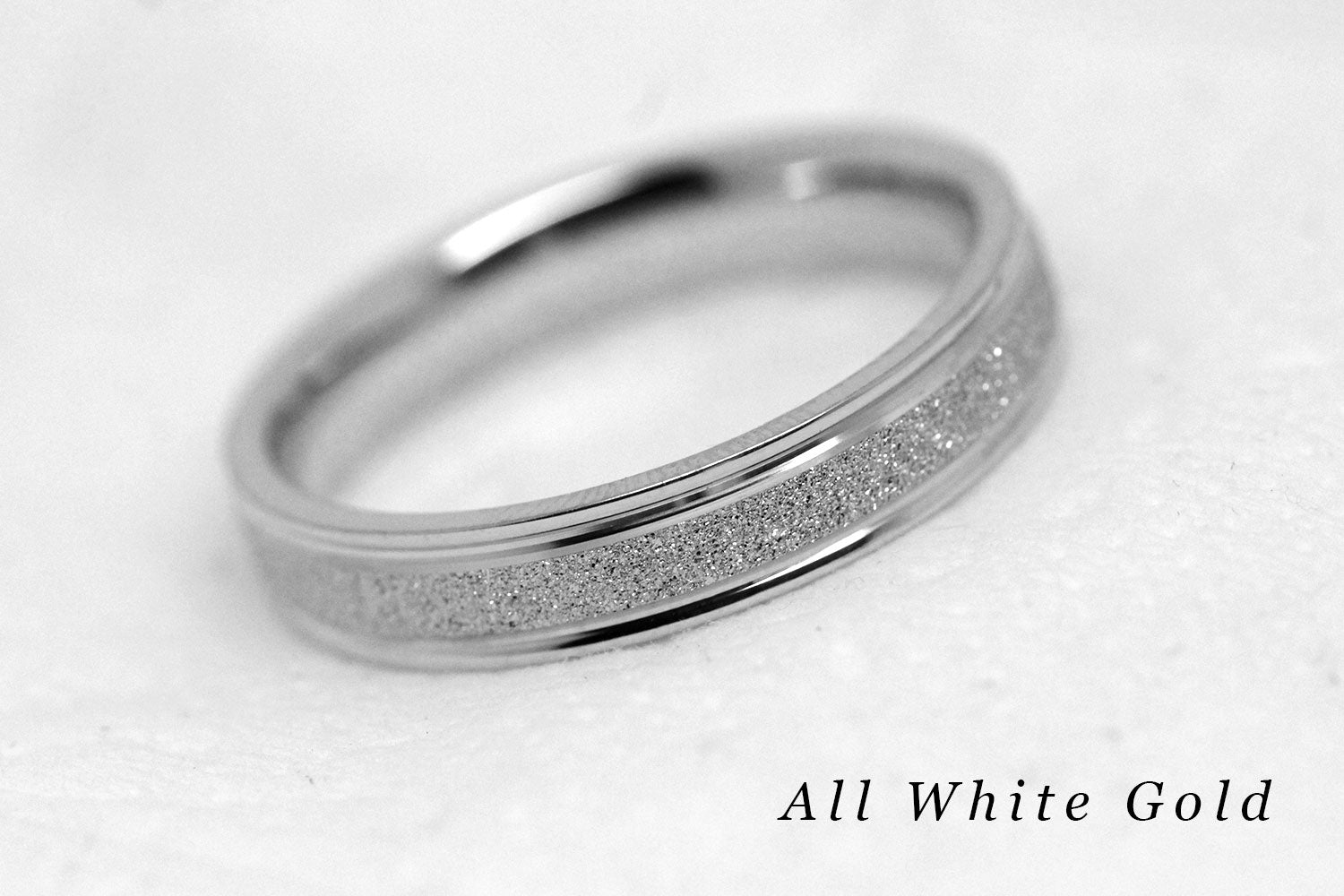 4mm solid gold wedding band for women and men with sparkly white gold centre and polished white gold base and edges, available in 10 karat 14 karat or 18 karat gold