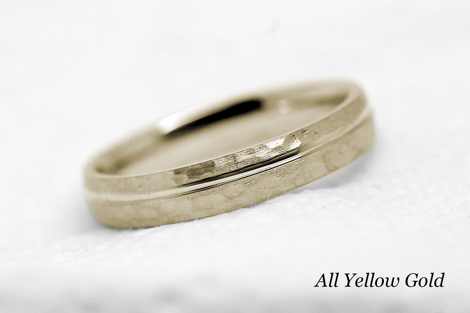 4mm 10 karat 14 karat or 18 karat solid gold hammered wedding band in yellow gold with off centre yellow gold polished line