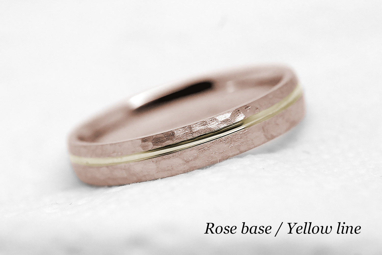 4mm 10 karat 14 karat or 18 karat solid gold hammered wedding band in rose gold with off centre yellow gold polished line