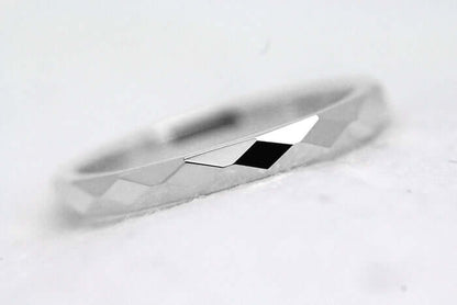 2mm sterling silver wedding band laying on its side