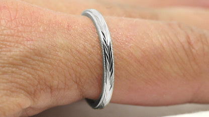 silver women's wedding ring with reflective filigree